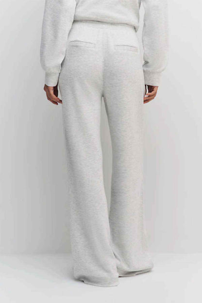 Grey wide-leg jogger trousers with elastic waistband and side seam stitching