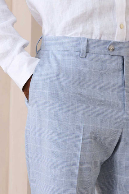 Light blue check suit trousers close-up of waistband and button