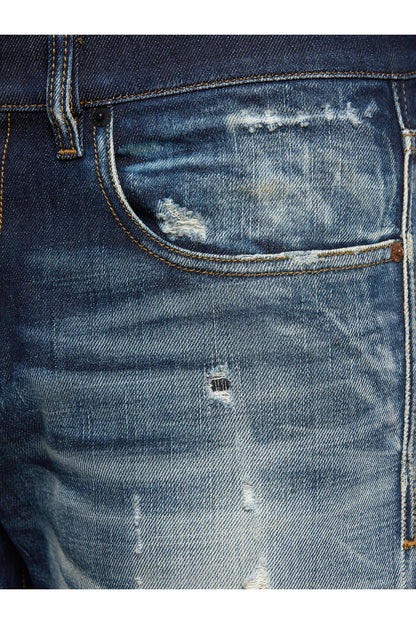 Men's blue jeans close-up of coin pocket and distressed knee rips
