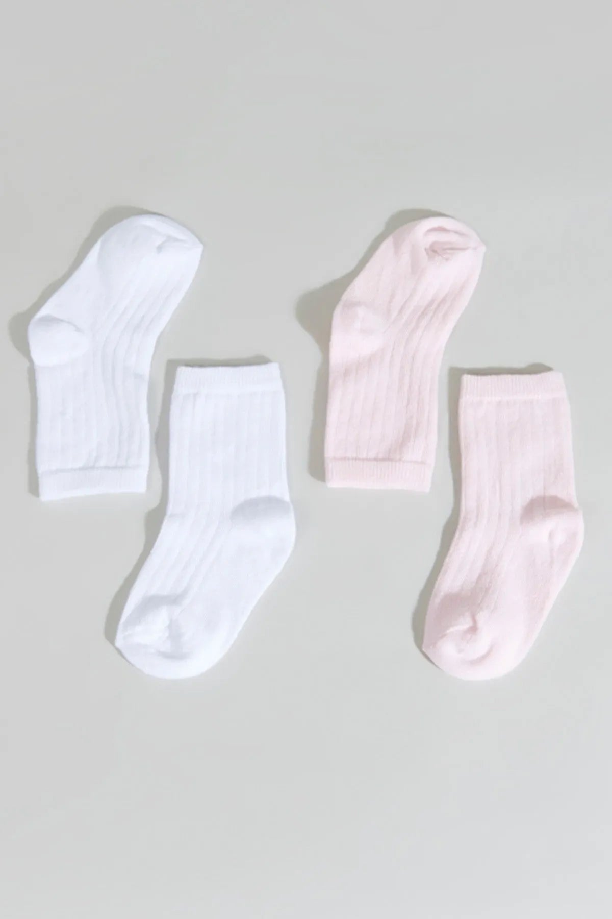 Pack of baby ankle socks: two white and two light pink, ribbed knit