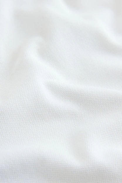 Children's white polo shirt fabric texture