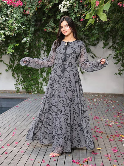 Long printed maxi dress with long sleeves, round neck, flared skirt, lace trim