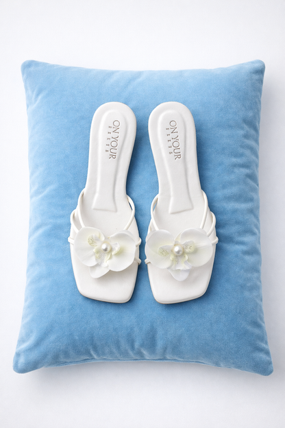 White floral slide sandals with pearl accents