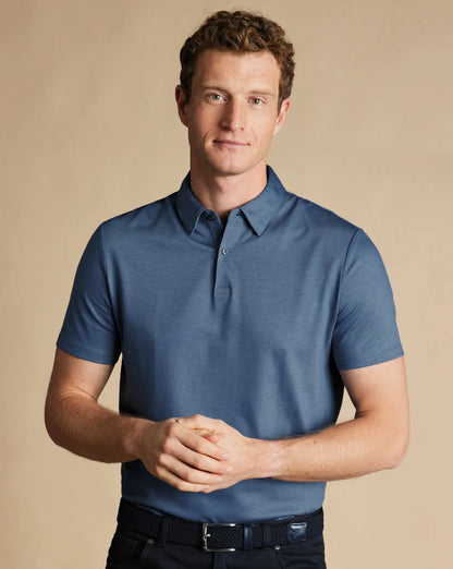 Blue polo shirt with short sleeves and ribbed collar