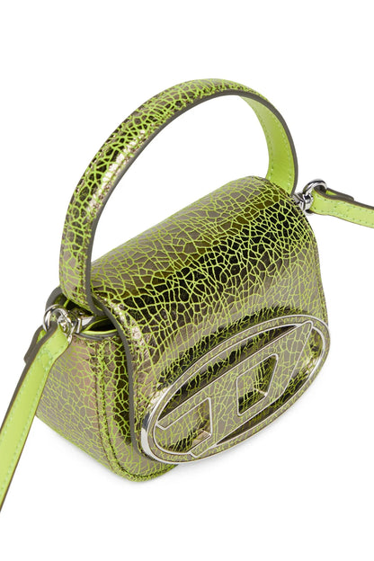 Green textured mini handbag with metallic front detail and shoulder strap.
