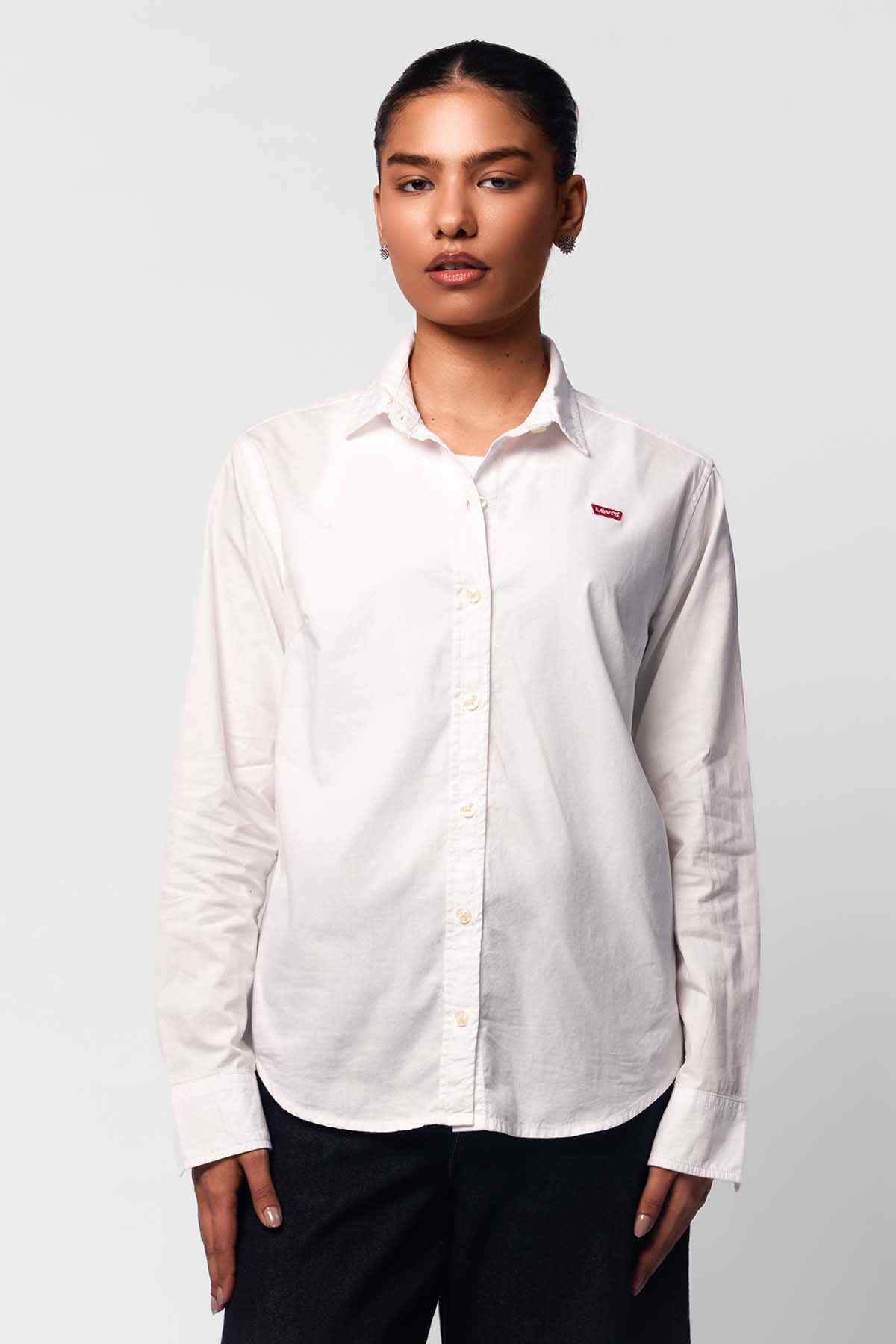 Levi's white button-up shirt with long sleeves and collar, chest logo