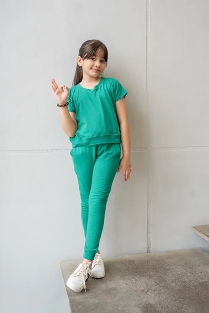 Teal kids tracksuit set with short-sleeve tee and jogger pants, standing pose