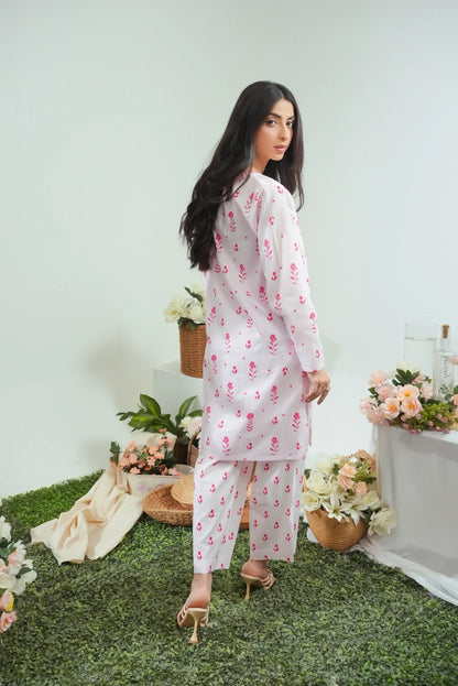 Women's white floral kurta and pajama set, side view, long sleeves and pink print