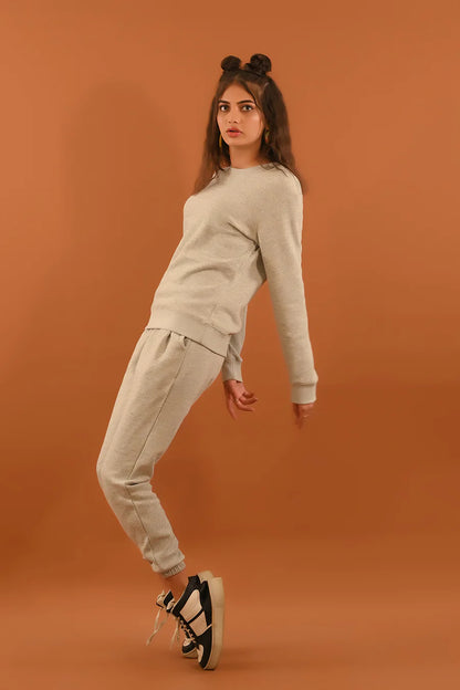 Light gray matching sweatshirt and joggers set with long sleeves and tapered fit