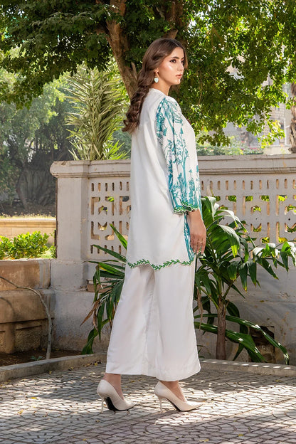 White kurta with blue floral side panel and green trim, ankle-length hem