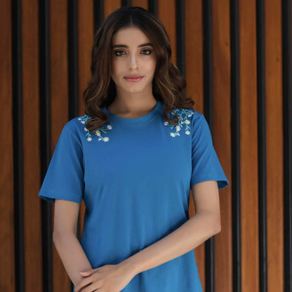 Blue short-sleeve blouse with floral embroidery at shoulders