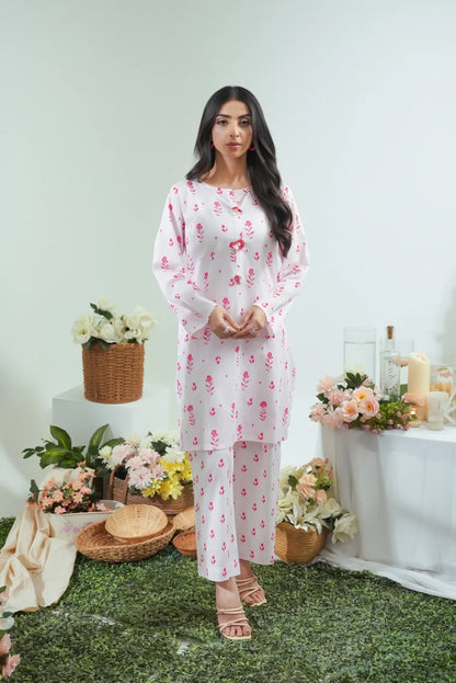 Women's white floral kurta and pajama set, front view with pink print and long sleeves