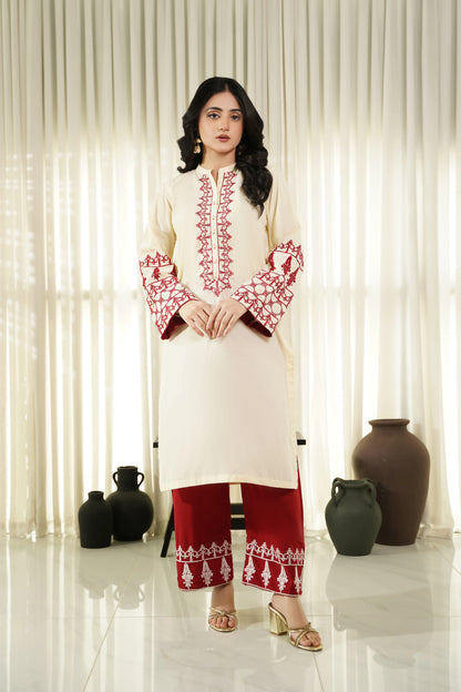 Embroidered cream kurta set with red trim, long sleeves and matching pants