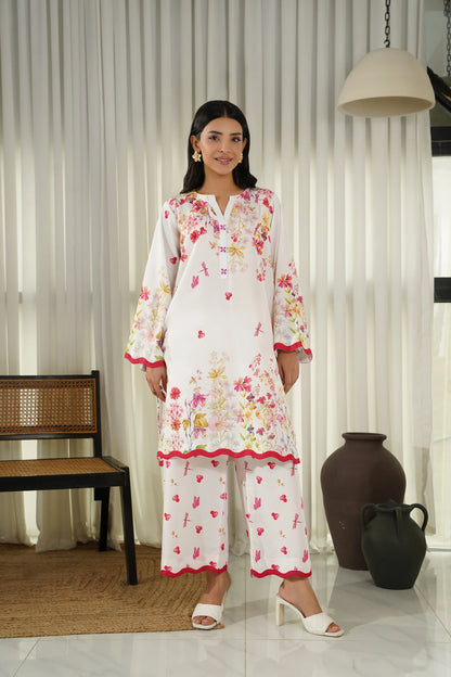 Women's white floral kurta set with red trim, long sleeves and matching straight pants