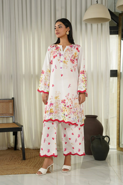 Women's floral kurta set with V-neck and red-trimmed cuffs; matching straight pants