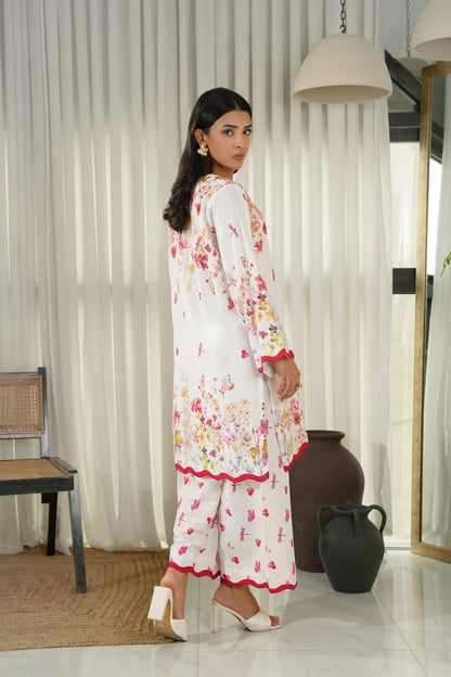 Women's white floral kurta set with red trim and long sleeves, matching pants