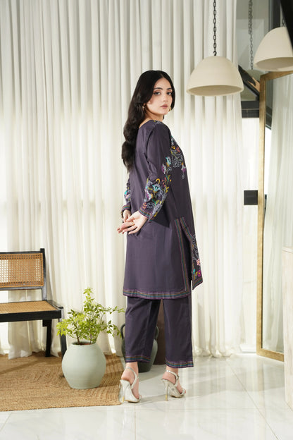 Embroidered dark kurta and matching pants set for women, side view with floral trim