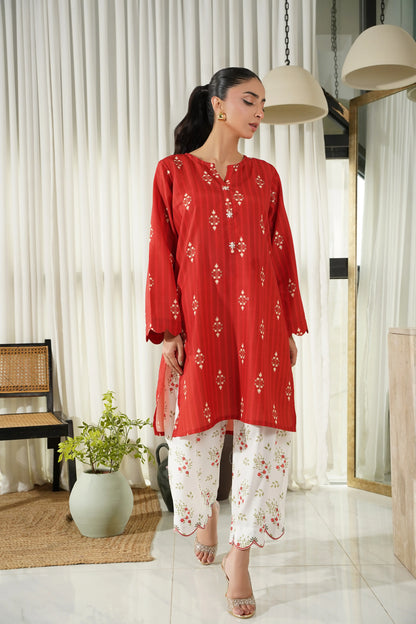 Red kurta and white floral pajama set with 3/4 sleeves and decorative neckline
