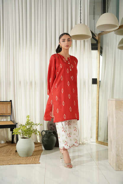 Red printed tunic kurta with white floral pajama bottoms, round neckline