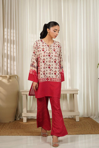 Floral cream kurta with red hem and maroon wide-leg pants, side view.