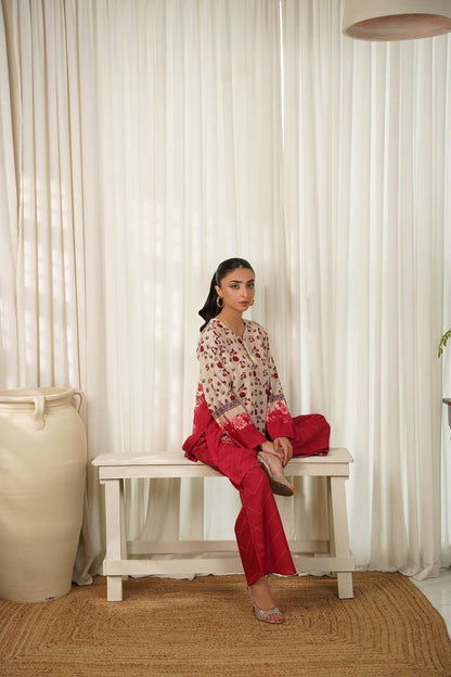 Floral cream kurta set with maroon pants, seated pose, long sleeves.