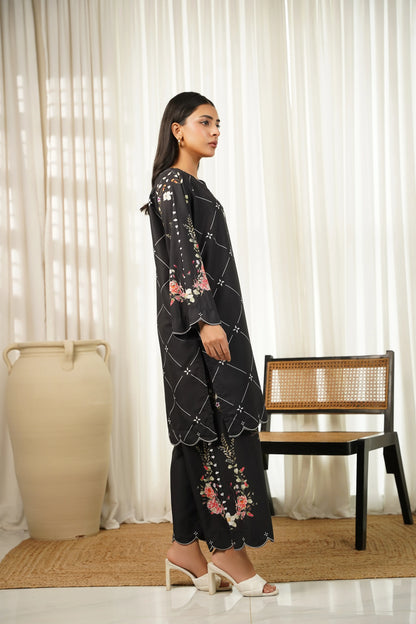 Black floral printed kurta and pants set, side view, long tunic with patterned front