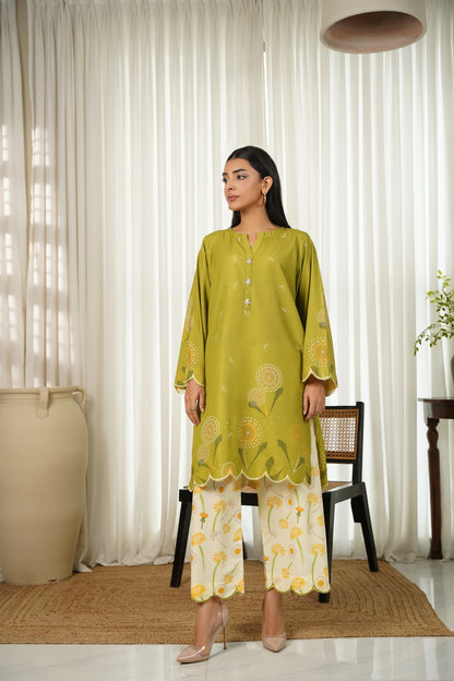Womenâ€™s green kurta with gold motifs and scalloped hem, paired with printed pants