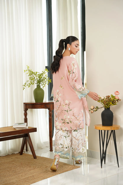 Side view floral kurta set: light pink long top with patterned sleeves and floral trousers