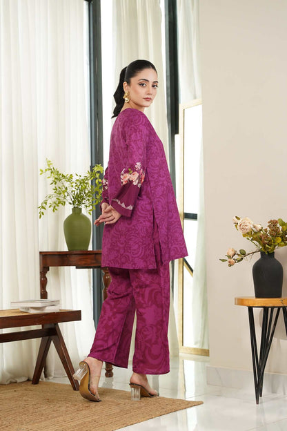 Women's purple kurta and pants set with floral detailing on cuffs and hem
