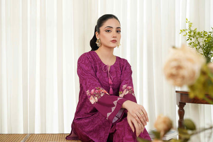 Women's purple patterned kurta and pants set with floral embroidery at sleeves