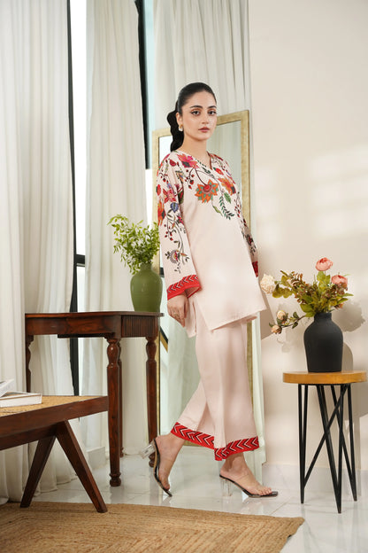 Off-white floral tunic with red border hem, matching beige pants and sandals