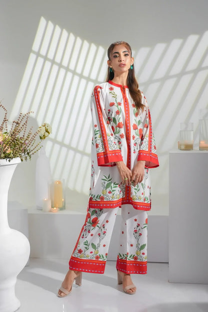 White floral kurta pajama set with long sleeves and red border detailing
