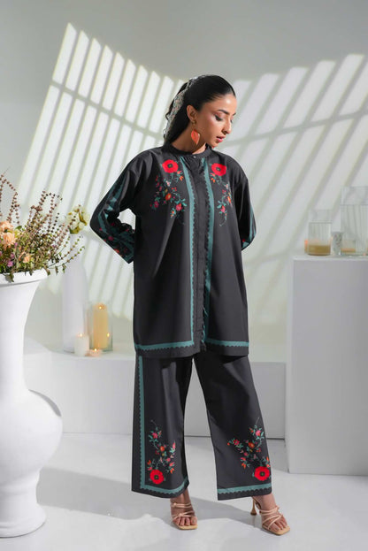 Black embroidered tunic and pants set with red flowers and teal piping along edges
