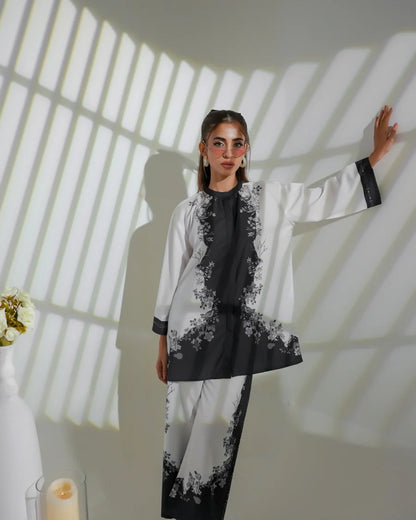 Two-tone floral tunic set with long black printed kurta and white sleeves.
