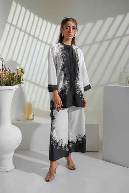 Two-tone floral tunic dress with white sleeves and black printed front.