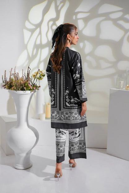 Black long kurta with white ornamental print, paired with matching patterned pants