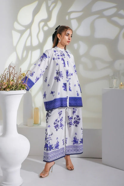 White and blue floral midi dress with long sleeves and navy border print on skirt