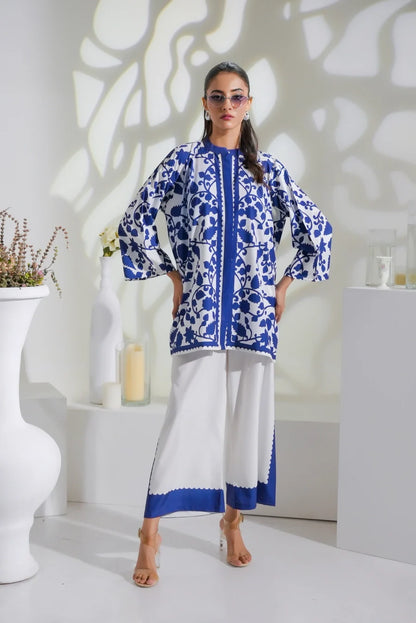 Blue-and-white printed long kurta with centered front detail, paired with white straight pants