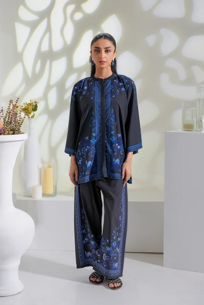 Women's dark kurta top with blue floral print and matching wide-leg pants
