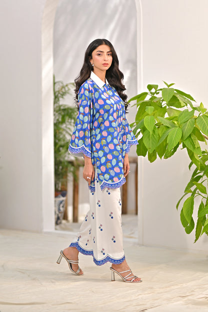 Blue printed kurta with white pajama pants, three-quarter sleeves and scalloped trim
