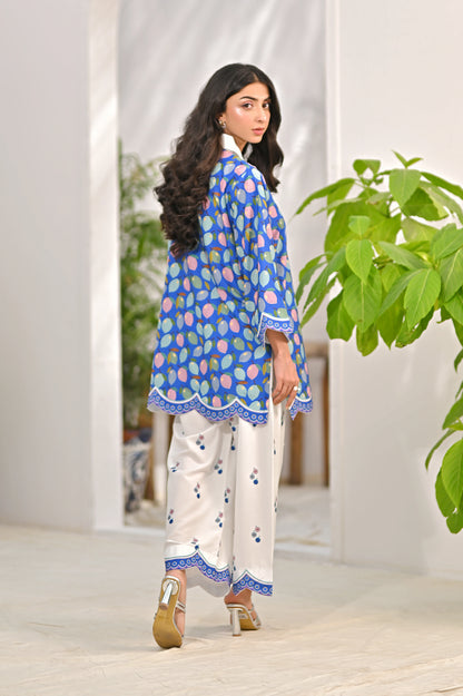 Blue printed kurta with white pajama pants, side view with scalloped border