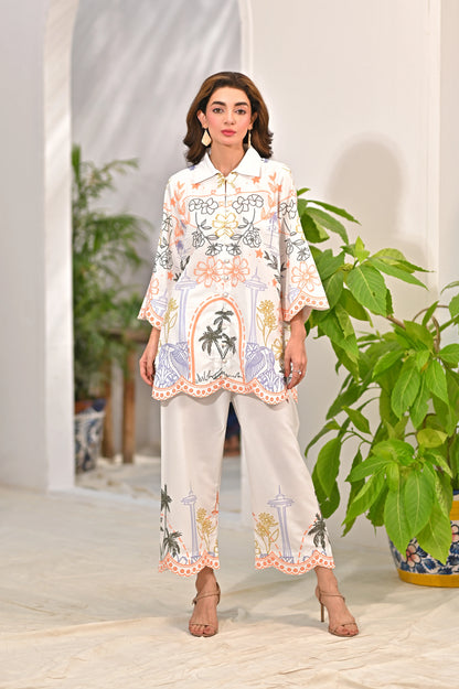 Women’s printed kurta and pants set, white with multicolor border trim and floral motifs
