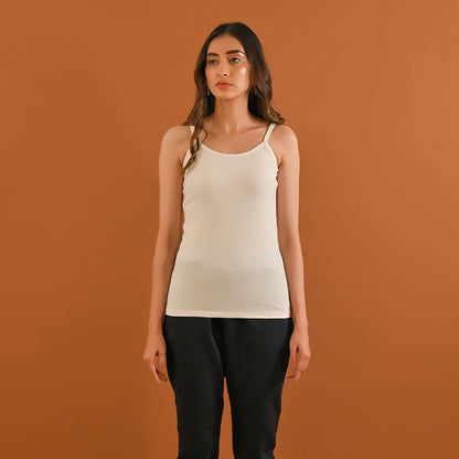 White camisole tank top with thin spaghetti straps and scoop neckline