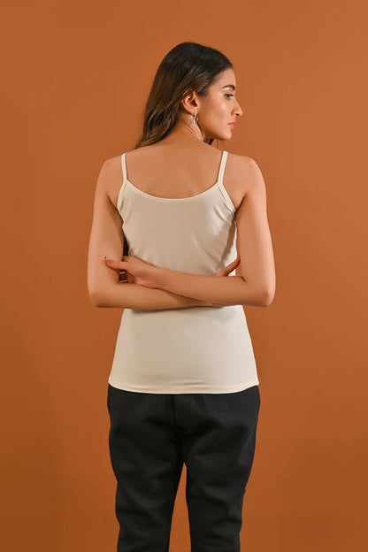 White camisole tank top with thin shoulder straps and scoop back neckline