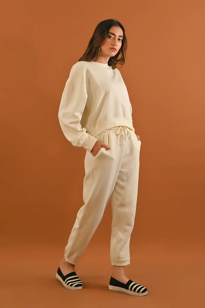 Cream sweatshirt and relaxed jogger pants set with gathered drawstring waist