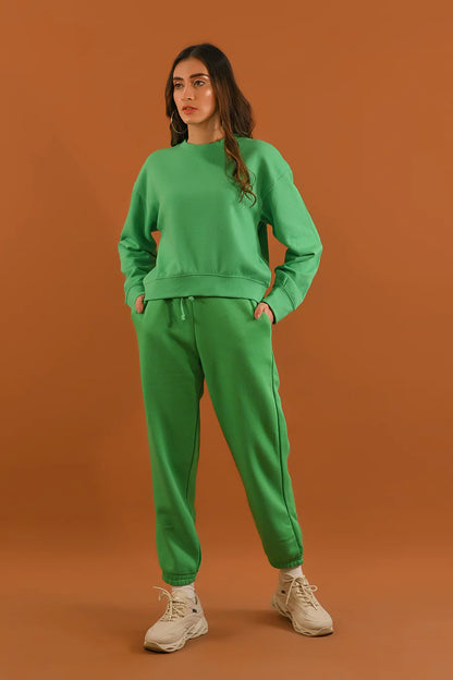Green crewneck sweatshirt and jogger pants, full-body side view