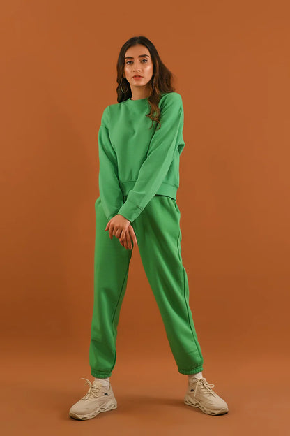 Green crew-neck sweatshirt and matching jogger pants, relaxed fit with elastic cuffs