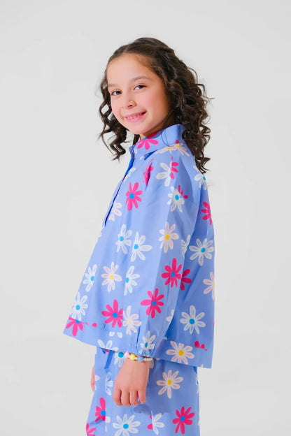 Kids blue floral pajama jacket and pants with high collar, side view