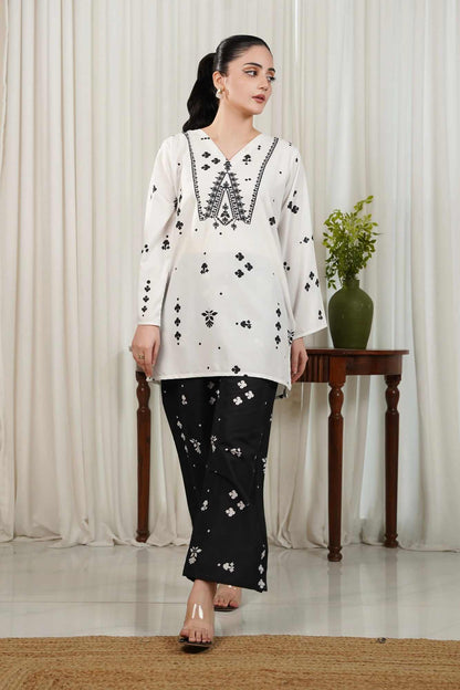 White V-neck printed kurta with black motifs and matching black printed trousers
