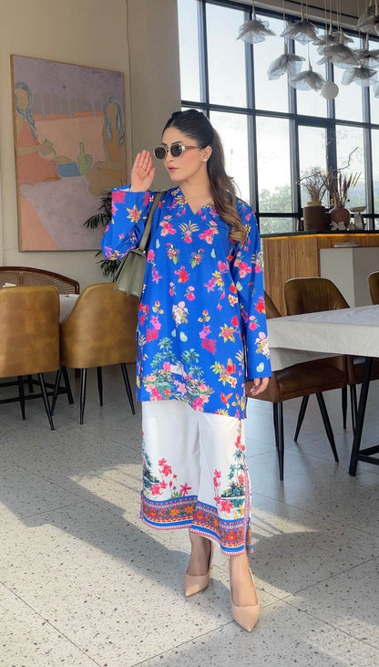 Blue floral printed long kurta with white pants, border hem and mid-calf length